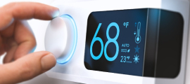 person adjusting thermostat to 68