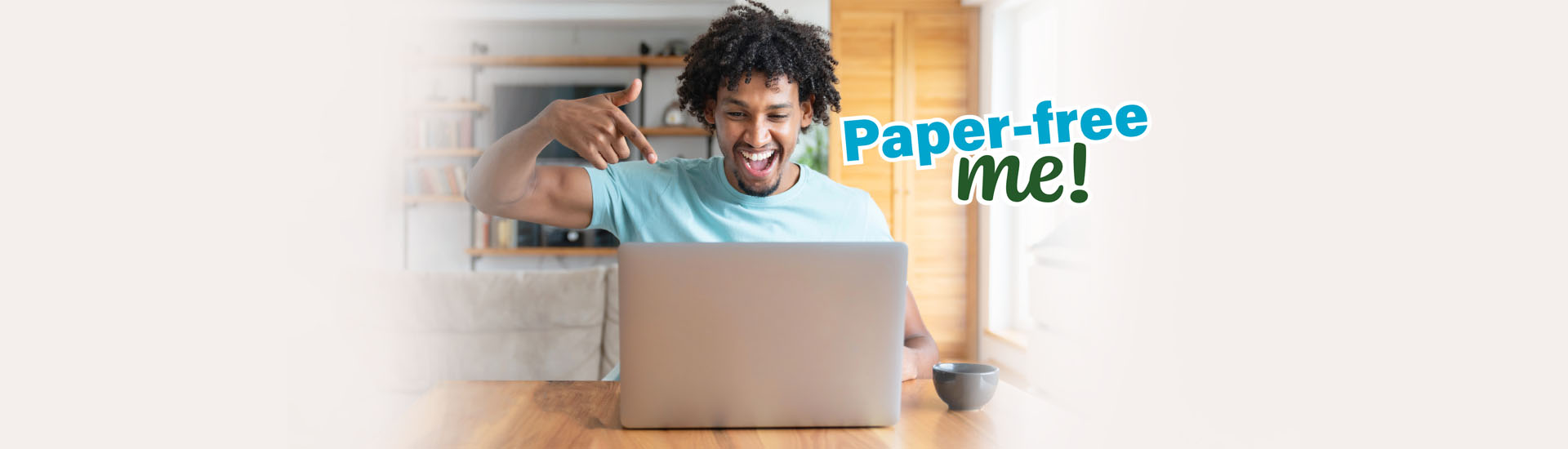 happy african american man pointing at laptop