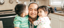 father and children hugging